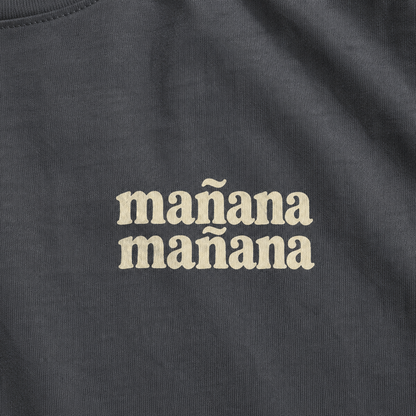 Black t-shirt with 'mañana mañana' text in beige.